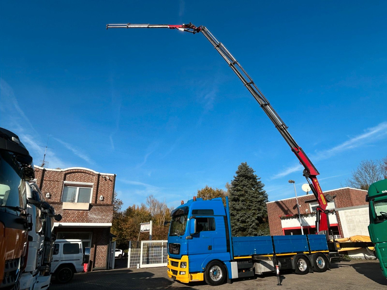 MAN 26.440 TGX Pritsche + PK 34002 + JIB Seilwinde - Camião grua: foto 1 MAN 26.440 TGX Pritsche + PK 34002 + JIB Seilwinde - Camião grua: foto 1