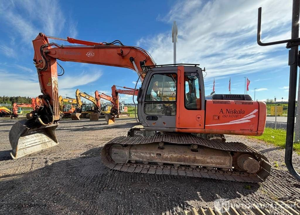 Hitachi ZX180, 2004, 12 652 h Tela-alustainen Kaivinkone, Lieto - Máquina de construção: foto 1 Hitachi ZX180, 2004, 12 652 h Tela-alustainen Kaivinkone, Lieto - Máquina de construção: foto 1
