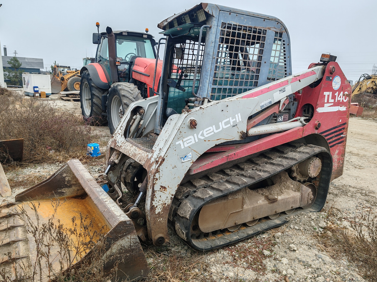 Takeuchi TL140 - Mini pá carregadora de rastos: foto 1 Takeuchi TL140 - Mini pá carregadora de rastos: foto 1