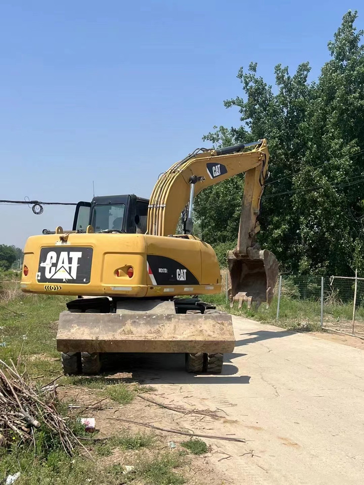 CATERPILLAR M317 - Escavadeira de rodas: foto 2 CATERPILLAR M317 - Escavadeira de rodas: foto 2