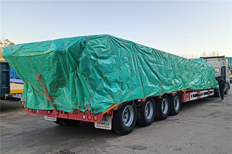TITAN 4 Axle 100 Ton Low Bed Truck Trailer for Sale In Zambia - Semi-reboque baixa: foto 1 TITAN 4 Axle 100 Ton Low Bed Truck Trailer for Sale In Zambia - Semi-reboque baixa: foto 1
