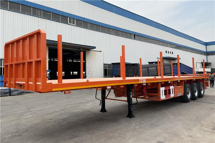 TITAN Container Flatbed Truck Trailer with Piles In Angola - Semi-reboque transportador de contêineres/ Caixa móvel: foto 2 TITAN Container Flatbed Truck Trailer with Piles In Angola - Semi-reboque transportador de contêineres/ Caixa móvel: foto 2