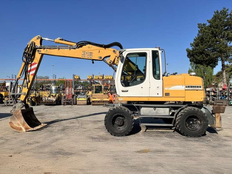 Liebherr A312 Litronic - Escavadeira de rodas: foto 4 Liebherr A312 Litronic - Escavadeira de rodas: foto 4