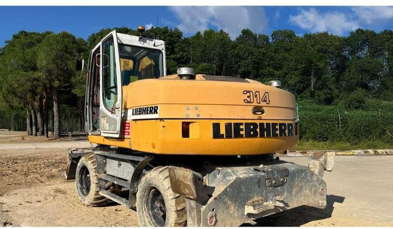 Liebherr A314 Litronic - Escavadeira de rodas: foto 2 Liebherr A314 Litronic - Escavadeira de rodas: foto 2