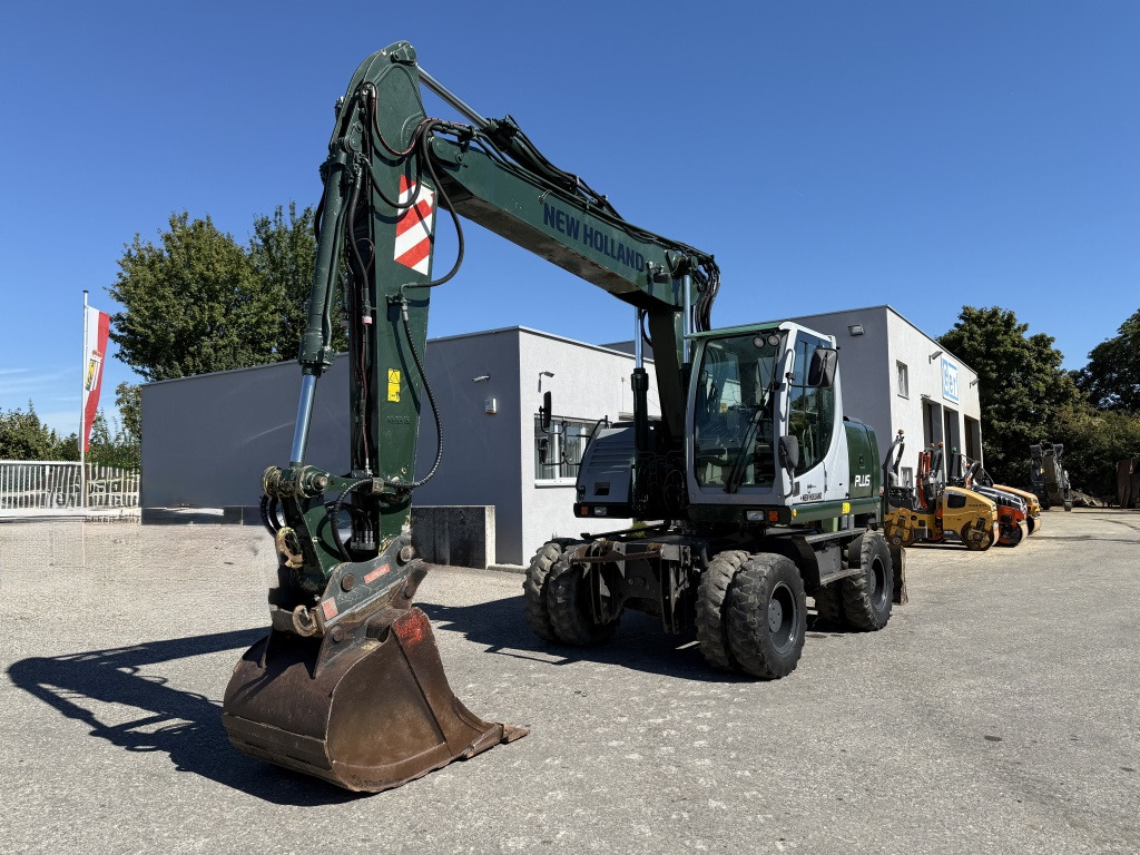New Holland MH-Plus (111695) - Escavadeira de rodas: foto 3 New Holland MH-Plus (111695) - Escavadeira de rodas: foto 3