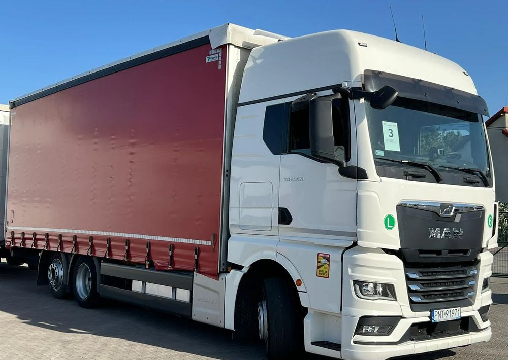 MAN TGX 26.470 z przyczepą Redos - Camião de lona: foto 3 MAN TGX 26.470 z przyczepą Redos - Camião de lona: foto 3