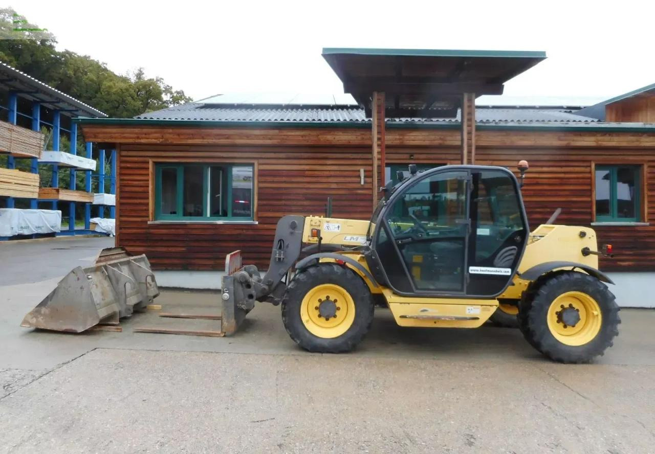 New Holland lm732 mit schaufel und gabel - Empilhador telescópico: foto 1 New Holland lm732 mit schaufel und gabel - Empilhador telescópico: foto 1