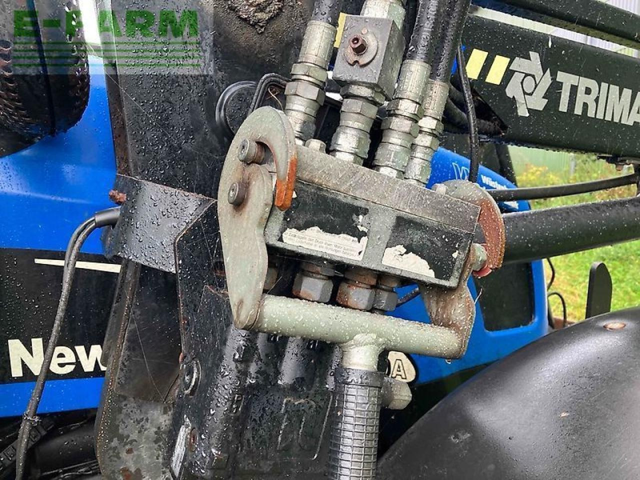 New Holland tl 100 a A - Trator: foto 5 New Holland tl 100 a A - Trator: foto 5