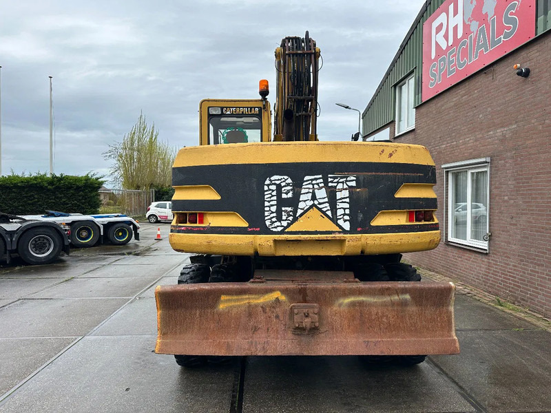 Caterpillar M315 +ROTO CE - Escavadeira de rodas: foto 5 Caterpillar M315 +ROTO CE - Escavadeira de rodas: foto 5