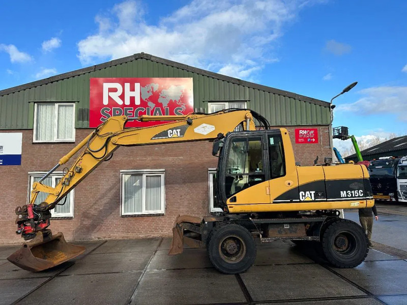 Caterpillar M315C WITH ROTOTILT, CE - Escavadeira de rodas: foto 1 Caterpillar M315C WITH ROTOTILT, CE - Escavadeira de rodas: foto 1