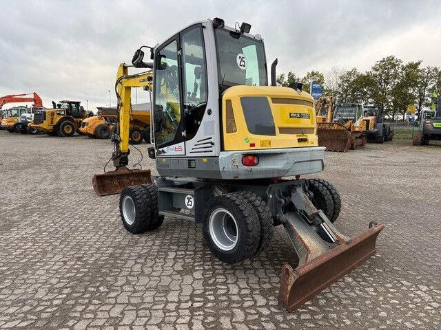 Neuson EW65, Verstellausleger, Hydr. S.W.S.,Div. Löffel - Escavadeira de rodas: foto 3 Neuson EW65, Verstellausleger, Hydr. S.W.S.,Div. Löffel - Escavadeira de rodas: foto 3