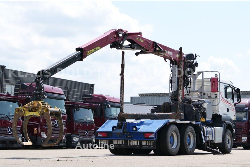 MAN TGS 33.500 - Timper truck+crane - Camião de transporte de madeira, Camião grua: foto 3 MAN TGS 33.500 - Timper truck+crane - Camião de transporte de madeira, Camião grua: foto 3