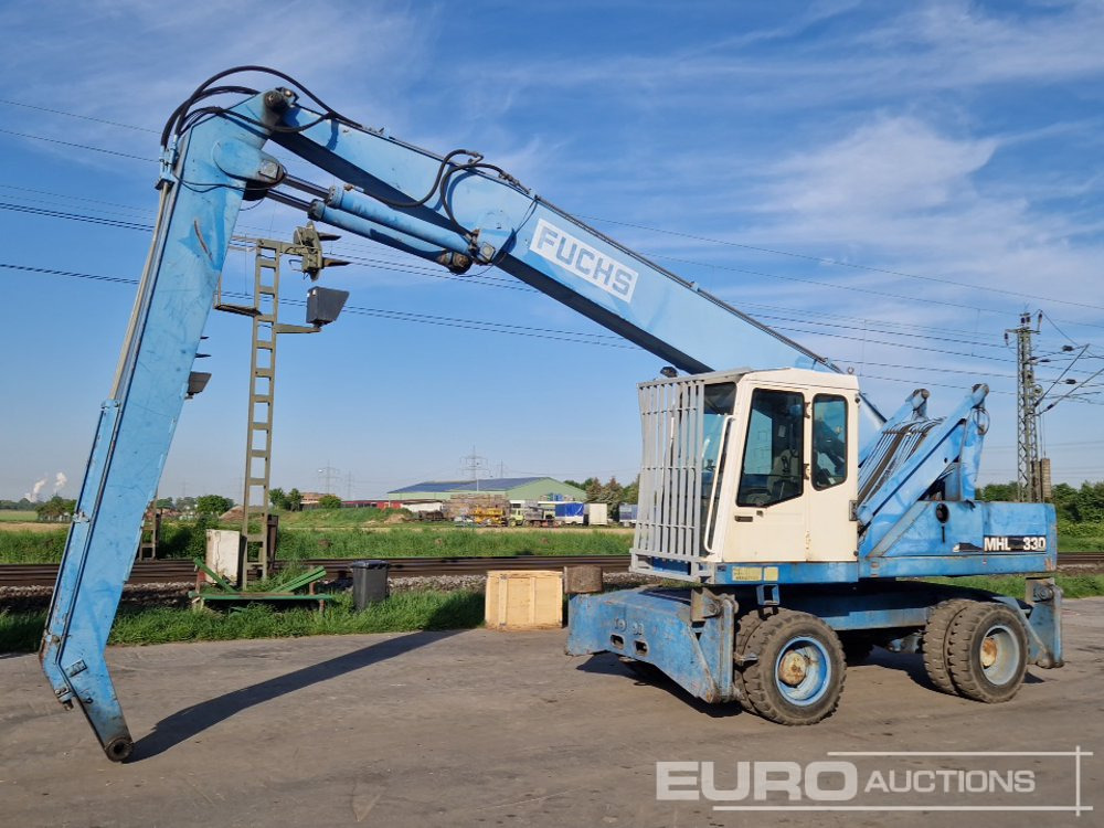 Fuchs MHL 330 - Escavadeira de rodas: foto 1 Fuchs MHL 330 - Escavadeira de rodas: foto 1