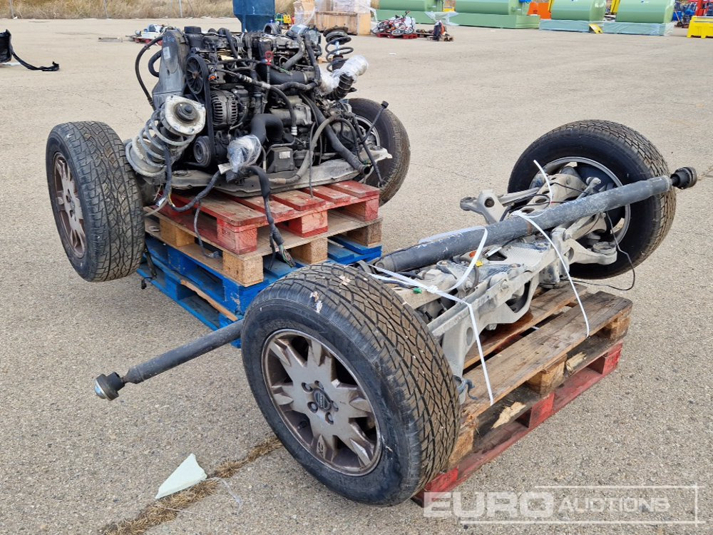 Pallet of Volvo XC70 Spares including Axles, Tyres, Engine components - Equipamento de construção: foto 1 Pallet of Volvo XC70 Spares including Axles, Tyres, Engine components - Equipamento de construção: foto 1