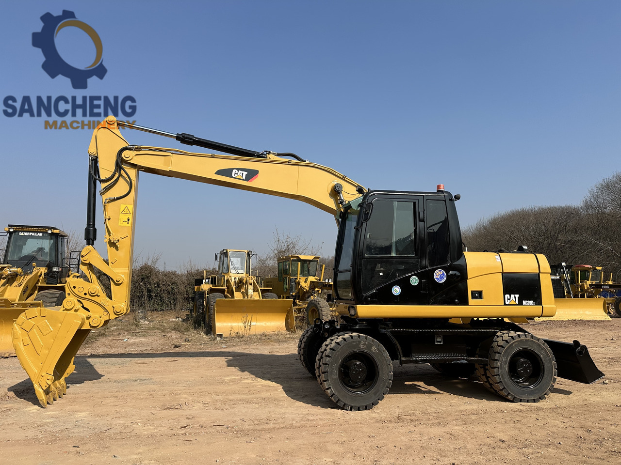 CATERPILLAR M320D2 - Escavadeira de rodas: foto 1 CATERPILLAR M320D2 - Escavadeira de rodas: foto 1