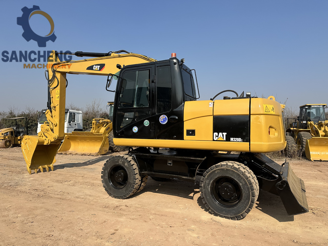 CATERPILLAR M320D2 - Escavadeira de rodas: foto 2 CATERPILLAR M320D2 - Escavadeira de rodas: foto 2