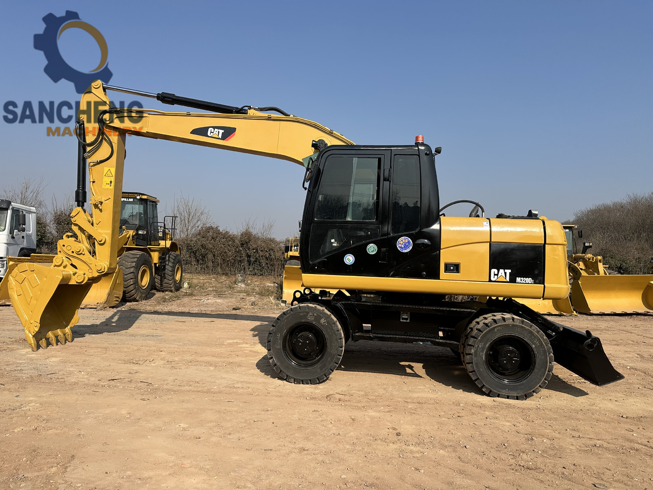 CATERPILLAR M320D2 - Escavadeira de rodas: foto 2 CATERPILLAR M320D2 - Escavadeira de rodas: foto 2