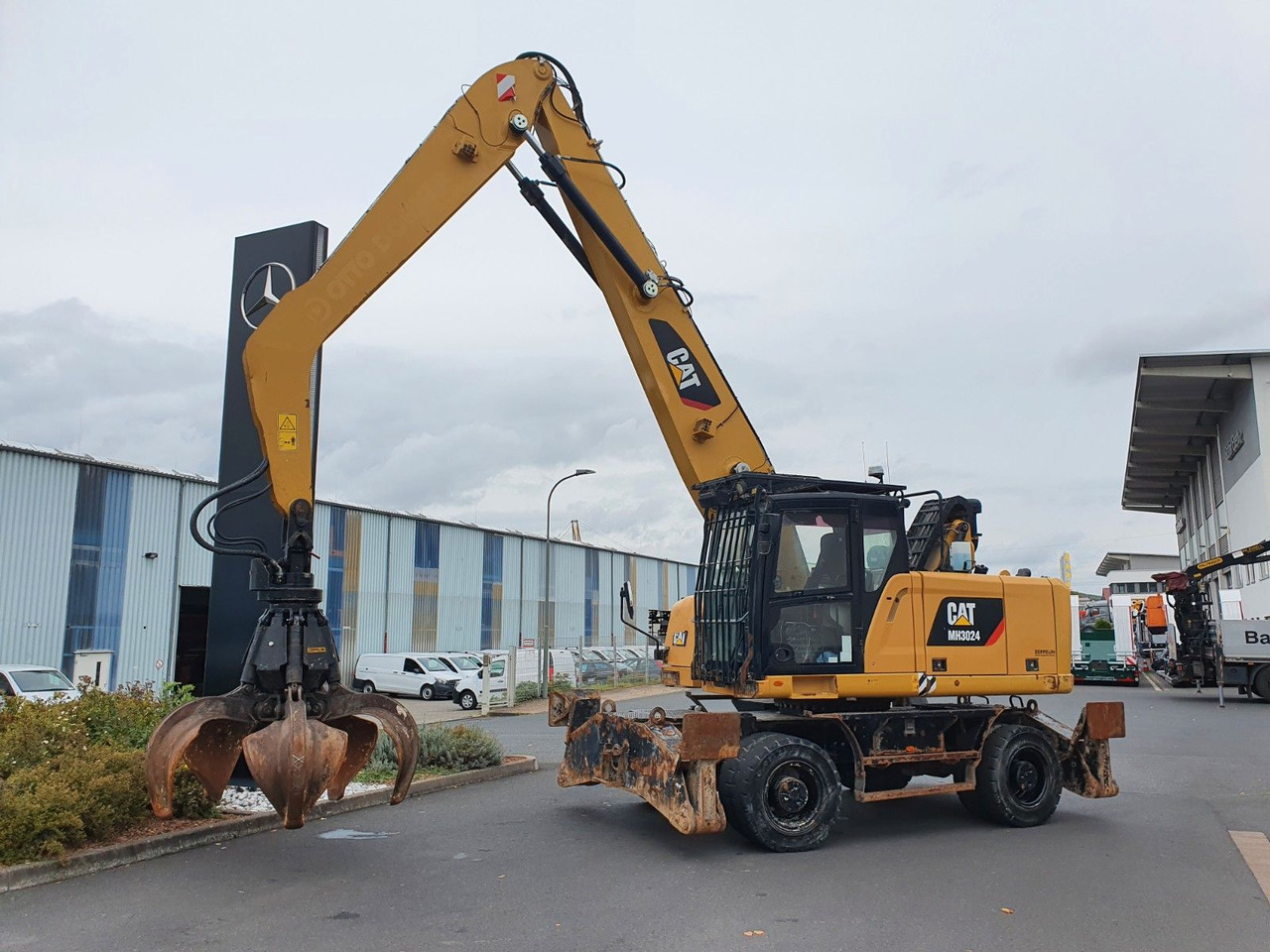 CAT MH3024 / MH 3024 / Greifer / 2018 / 9.424h - Escavadeira de rodas: foto 2 CAT MH3024 / MH 3024 / Greifer / 2018 / 9.424h - Escavadeira de rodas: foto 2