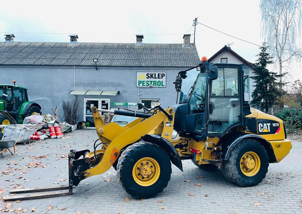 Pá carregadora de rodas Caterpillar 907H: foto 6