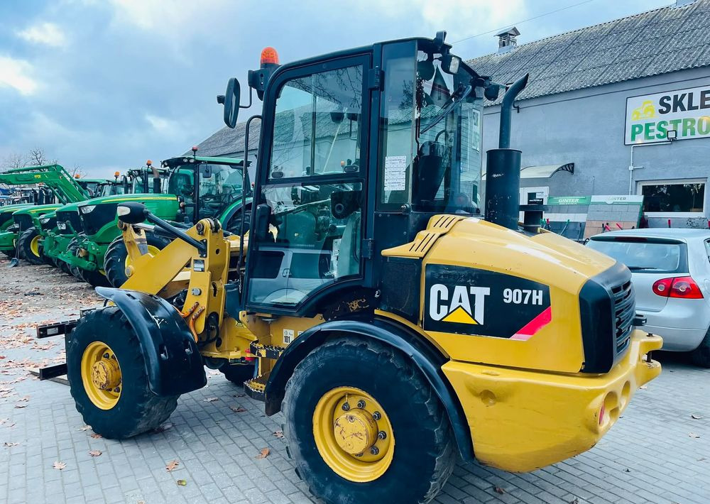 Pá carregadora de rodas Caterpillar 907H: foto 11