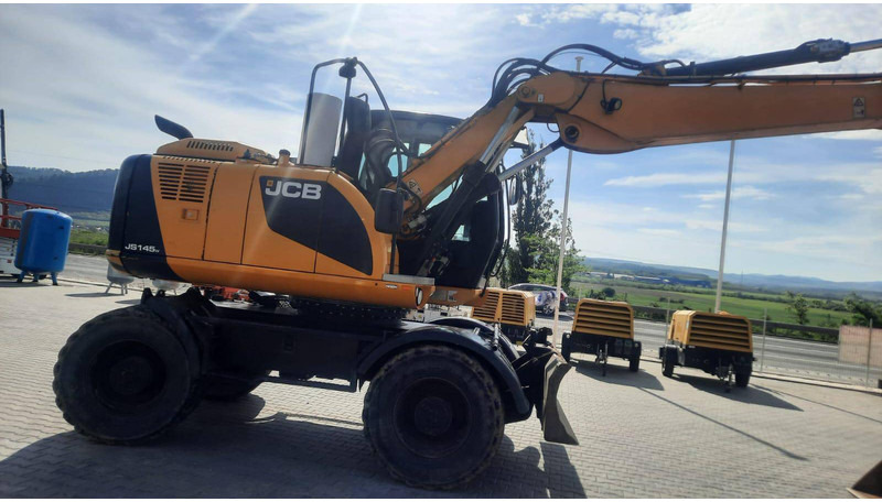JCB JS145W - Escavadeira de rodas: foto 1 JCB JS145W - Escavadeira de rodas: foto 1