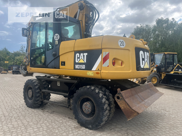Cat M315D - Escavadeira de rodas: foto 1 Cat M315D - Escavadeira de rodas: foto 1