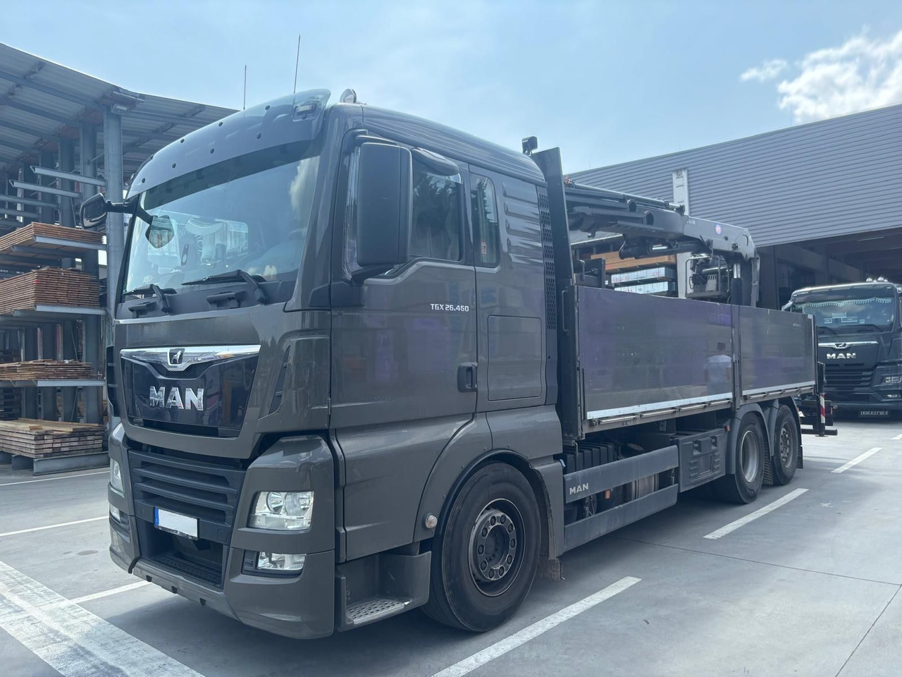MAN 26.460 TGX Baustoffkran HMF 2110-L3 - Camião grua: foto 1 MAN 26.460 TGX Baustoffkran HMF 2110-L3 - Camião grua: foto 1